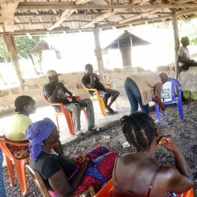 Teaching villagers how to wash hands